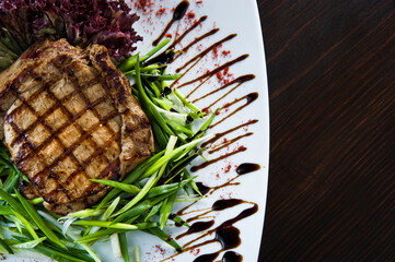 Grilled beef steaks on the plate.