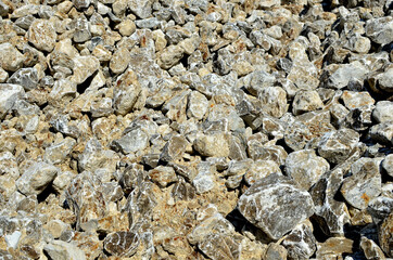 Natural gray gypsum stone. Close up image of stones with black and white. Industrial mining area. Limestone mining, quarry - Imagen