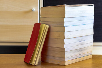 stack of books on a wooden table