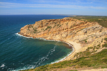 Fototapeta na wymiar Bay with beach on rocky atlantic coastline of Portugal
