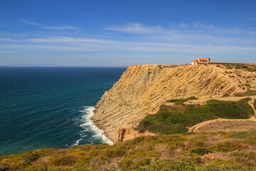 Fototapeta na wymiar Rocky atlantic coastline of Portugal with waves