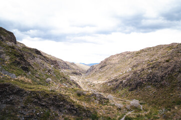 Fototapeta na wymiar Green meadows in a mountainous hiking area