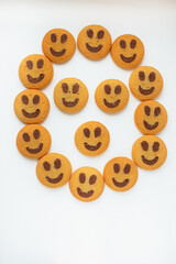 Fototapeta premium A set of smiling biscuit cookies isolated on white background with copy space. Smile concept. Sweet greeting