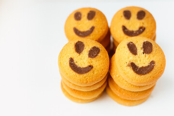 A set of smiling biscuit cookies isolated on white background with copy space. Smile concept. Sweet greeting