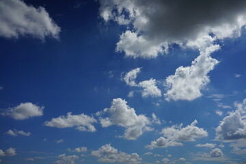 Naklejka na ściany i meble White clouds with the blue sky on a sunny day