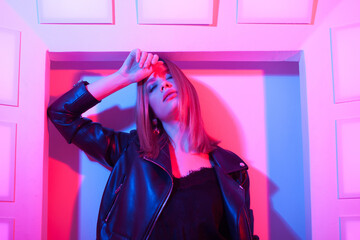 Futuristic style portrait in blue and purple light.