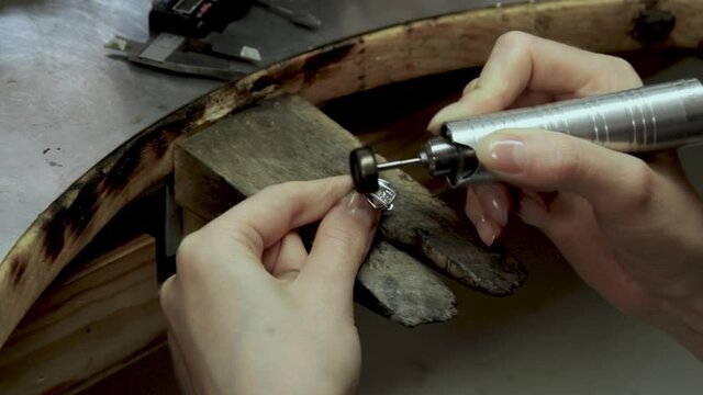 Profession jeweler. Craft jewelery making. Hands of a jeweller . Handwork . Close up.