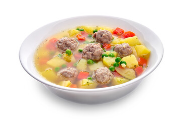 Meatballs with green peas in the potato soup