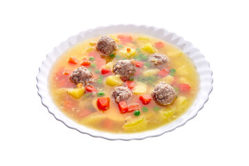 Meatballs with green peas in the potato soup