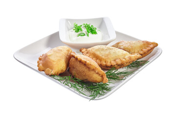 Chebureks on a white plate isolated on a white background