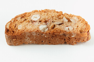 Popular Italian Biscotti or Cantucci biscuit cookie stuffed with nuts isolated on white background with copy space.Side view closeup
