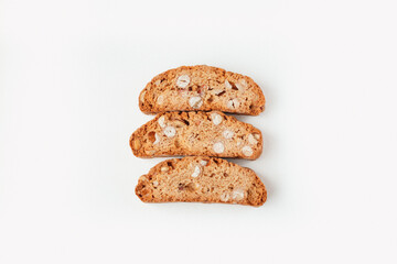 Three famous Italian Biscotti or Cantucci cookies stuffed with nuts  isolated on white background.