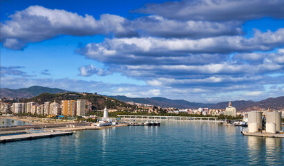 Fototapeta na wymiar Buildings on the coast near the harbor of Malaga Spain