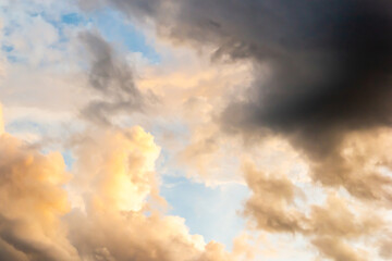 Colorful sunset sky above dark clouds with dramatic light before raining in twilight time . Beautiful sunset background