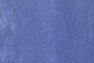 Beautiful vintage blue background with old blue paint with a rough surface, streaks and uneven texture of blue paint on an old rough surface