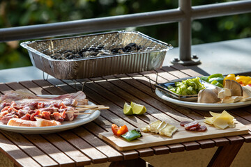 barbecue of chicken heart, vegetables and salmon skewer doing at home