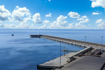 Fototapeta premium The Seawall in Malaga Spain out to the blue sea and sky