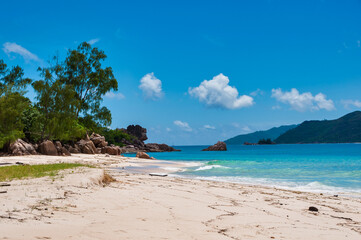 The coastline white sand beach of the island of Curieuse, Seychelles
