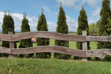 Wooden fence from boards in the Polish countryside
