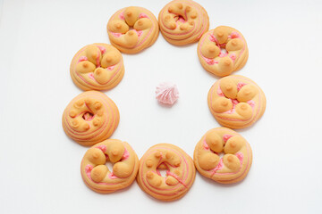 Cookie biscuit with pink  sugar cream icing  isolated on white background