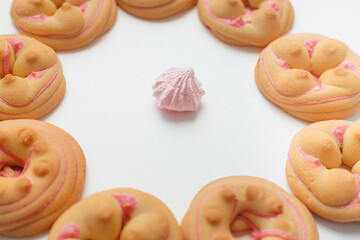 Cookie biscuit with pink  sugar cream icing  isolated on white background