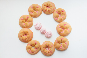 Cookie biscuit with pink  sugar cream icing  isolated on white background