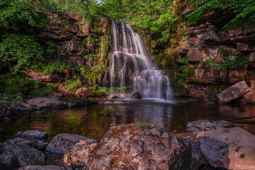 Naklejka na ściany i meble East Gill Force, Keld, Swaledale, in the dramtic countryside of North Yorkshire, fantastic adventure travel destination or holiday vacation to view picturesque scenery at sunrise or sunset
