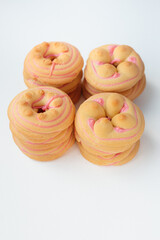 Cookie biscuit with pink  sugar cream icing  isolated on white background