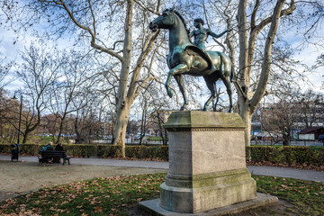 Cupid riding Pegasus statue in park over moat in historic part of Wroclaw city, Poland