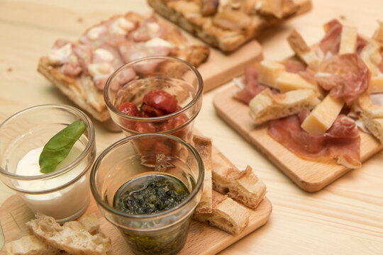Close up on traditional happy hour appetizers from the italian tradition.