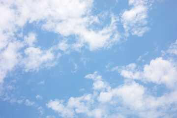 Blue sky background and white clouds soft focus, and copy space