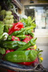 Vegetable stand with peppers and artichokes