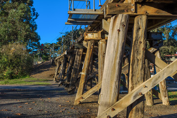 An old wooden construction railway bridge is still in use in Eltham, Victoria, Australia for suburban trains