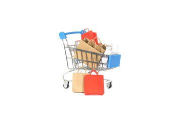 Colorful shopping bags in cart isolated on white background.