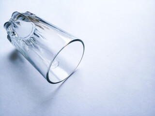 ampati transparent glass tumbler on plane background having space