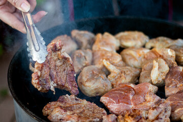 Pork meat on grill, family party, closeup