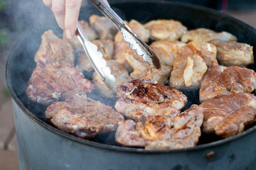 Pork meat on grill, family party, closeup