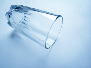 ampati transparent glass tumbler on plane background having space