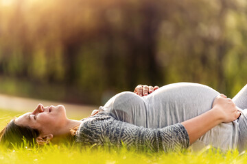 Pregnant woman in park