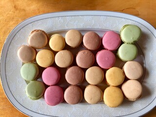 flat lay image of cute macaroons in different colours
