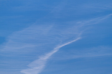 Naklejka na ściany i meble White clounds on the blue sky