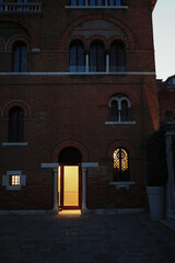 Fototapeta premium Old brick building architecture in the alley of Venice