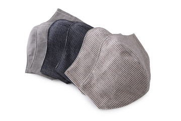 heap of face mask handmade from fabric cotton cloth for sale, objects isolated on white background