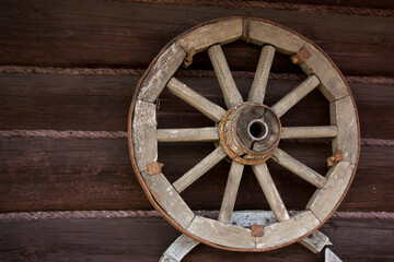 Wooden wheel on the wall