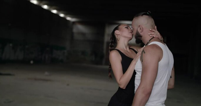 Seductive embrace of couple in love caress each other in abandoned building