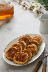 Cheese pancakes, breakfast food. Rounf frities made from cotage cheese.