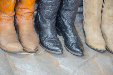 Old colored top boots show on floor