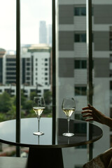 Two champagne glass inside a hotel room