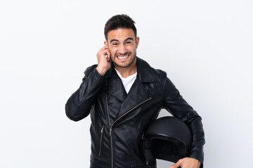 Fototapeta premium Man with a motorcycle helmet frustrated and covering ears