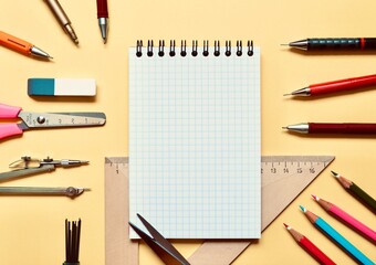 School stationery and space for text on a beige background.  The view from the top.